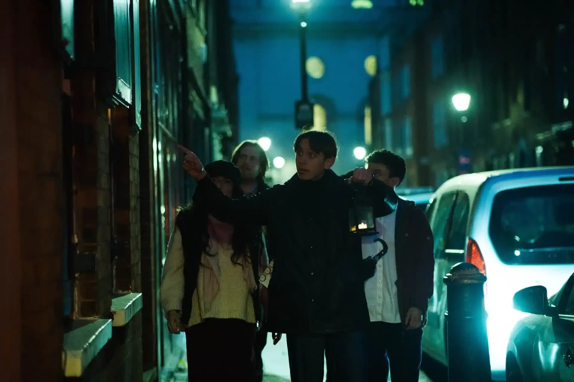 Jack the Ripper walking tour group exploring London night streets in Whitechapel